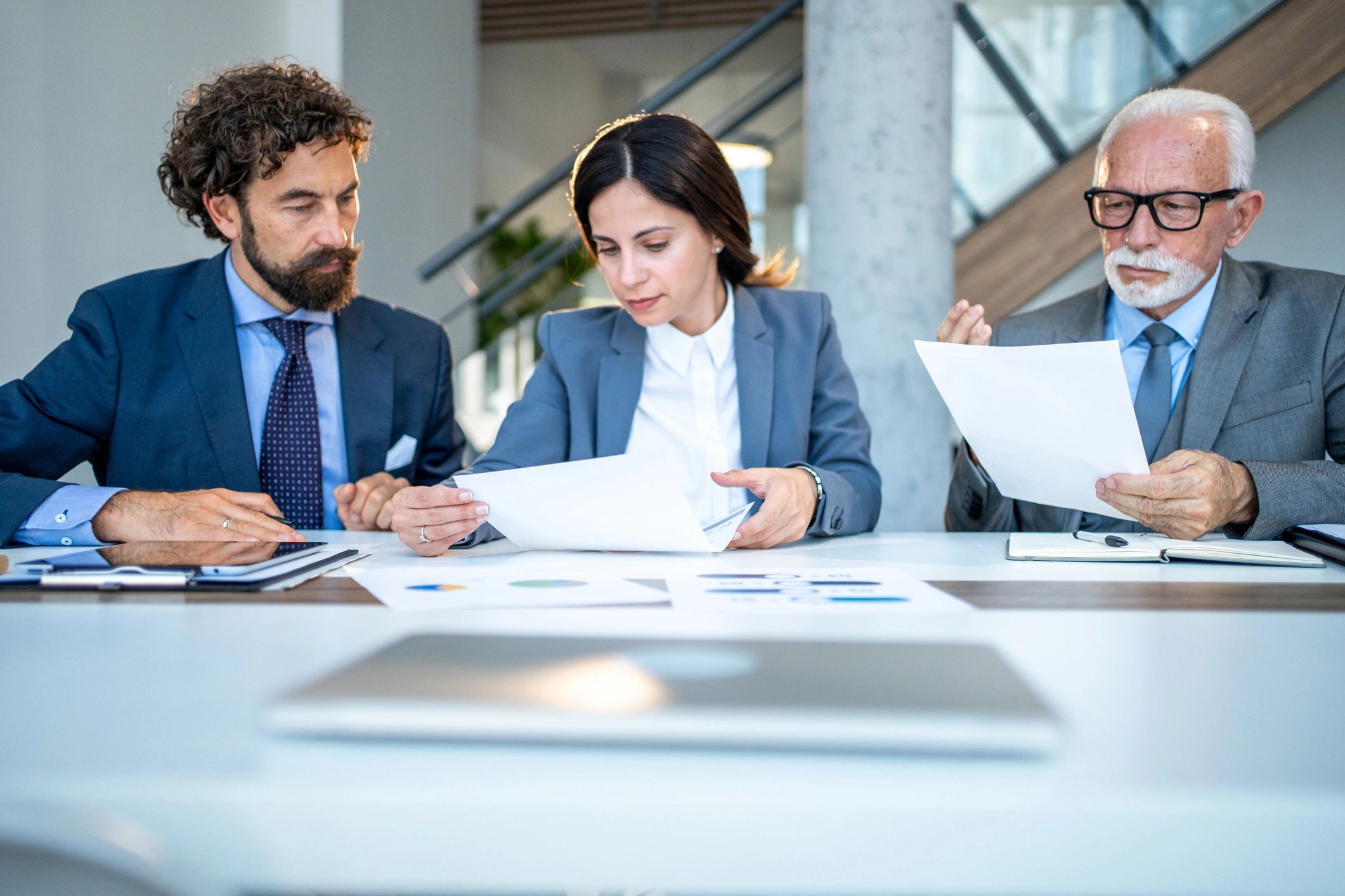 Business team reviewing documents and charts in a meeting